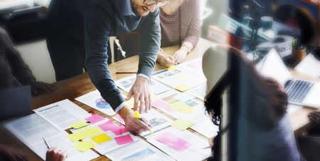 Picture of people designing a strategy document